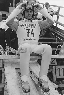 World Cup, ski jumping, Ingo Lesser (DEU) sits on the jumping hill and adjusts his helmet as he prepares to jump, 1991, Germany, Europe