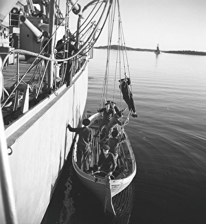 During World war II. The war ship Sverige during navy exercises at sea. The life boat is being fitted and has been lowered down in the water. Sweden june 1940. Kristoffersson ref 141