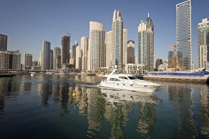 Yacht in front of the skyscrapers of Dubai Marina