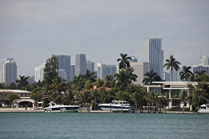 Yachts, villa and the skyline of Miami