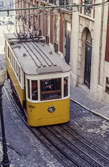 Yellow funicular in steep street of Lisbon Lisbon