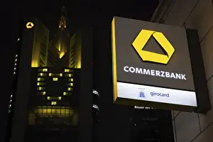 A yellow heart glows on the facade of the Commerzbank Tower in Frankfurt am Main at Christmas time in the evening