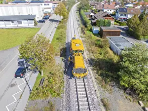 Yellow maintenance vehicle on rails
