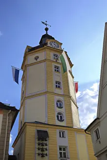 Framed Print : Yellow tower of the Herrieder Tor with flags under a blue sky Framed Print : Yellow tower of the Herrieder Tor with flags under a blue sky