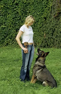 Young blond girl with German Shepherd