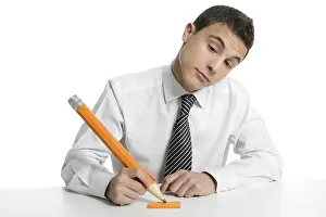 Young businessman student thinking gesture with huge giant pencil