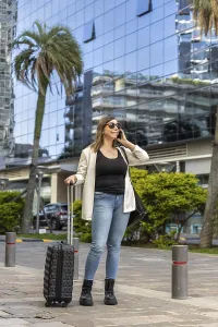 Young businesswoman is walking down the street in a modern city