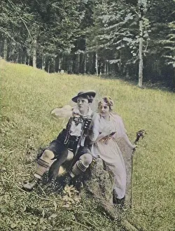 Young couple in alpine traditional costume