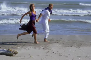 Young couple walking on the beach