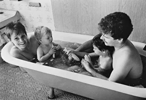 Young family in a bath tub, East Germany