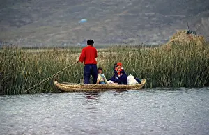 Young family with young children in a reed boat
