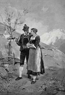 Young lovers walking in the mountains in spring