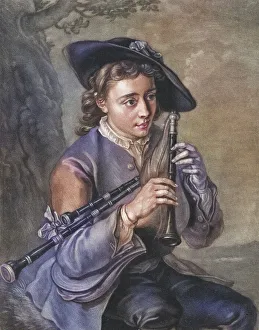 Young man with several flutes, musician