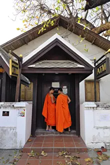 Category Historic EN Prints: Young monks at an ATM on Sisavangvong Road