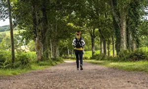 A young mother with her baby in the Broceliande forest