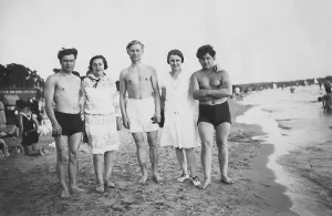 Five young people on the beach