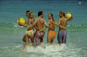 Young people by the sea Bathing, playing