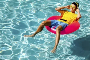 A young teenage boy in a yellow t-shirt