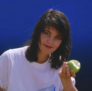 Young woman with apple