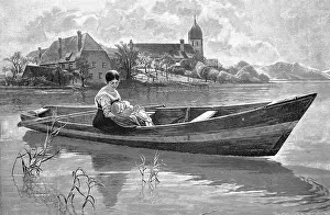 Young woman with her baby is on a rowing boat on the lake