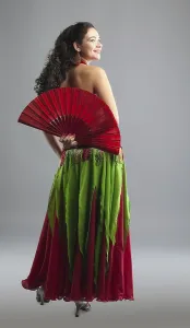 Young woman belly dance with fan in oriental arabic costume