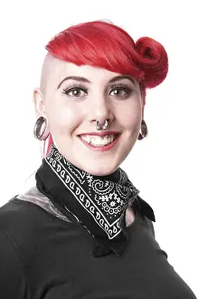 Young woman with facial piercings and tattoos