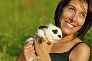 Young woman holding a Pygmy Rabbit (Brachylagus idahoensis)