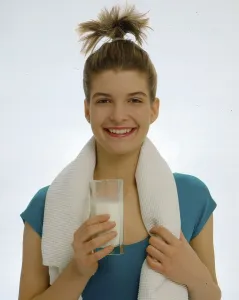 Young woman with milk glass