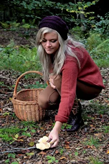 Young woman picking mushrooms, Ystad