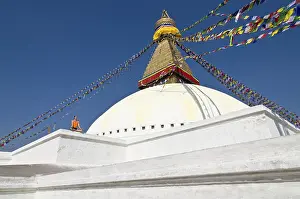 Young woman practicing yoga at the Boudnanath stupa