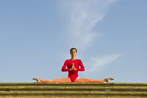 Young woman practising Hatha yoga