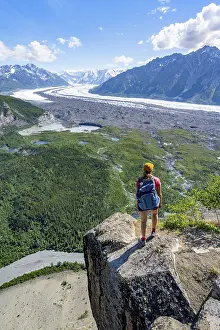 Young woman on a rocky outcrop enjoying the view