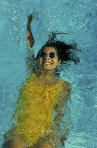 Young woman swimming in swimming pool