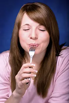 Young woman tasting food