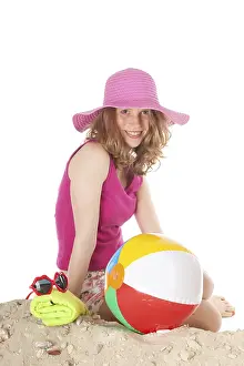Young woman on vacation at the beach in the studio