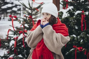 A young woman in a white beanie