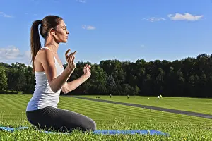 Young woman during yoga meditation in the park