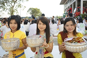 Category Buddhism Prints: Young women collect donations at the Bigboon pilgrims procession