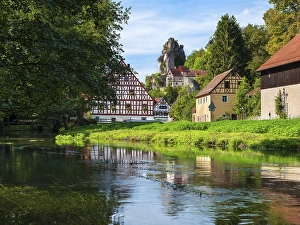 Zechenstein rock formation and half-timbered houses on the Puettlach river