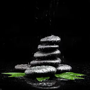 Zen stones and leaves with water drops