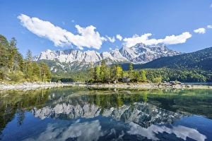 Zugspitze massif and Zugspitze reflected in Eibsee lake